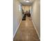 Long hallway with tile flooring, showing access to other areas at 414 S Yadkin Ave, Spencer, NC 28159