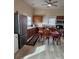 Bright kitchen with wood cabinets, vinyl flooring, and a dining table at 414 S Yadkin Ave, Spencer, NC 28159