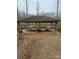 Wooden picnic shelter with several tables at 414 S Yadkin Ave, Spencer, NC 28159