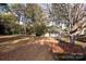 Yard with large trees and detached garage at 4308 Glenfall Ave, Charlotte, NC 28210