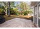 Large backyard with patio and tree-lined border at 4308 Glenfall Ave, Charlotte, NC 28210