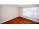 Small bedroom with hardwood floors and plantation shutters at 4308 Glenfall Ave, Charlotte, NC 28210