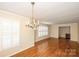 Dining room with hardwood floors and chandelier at 4308 Glenfall Ave, Charlotte, NC 28210