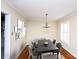 Virtually staged dining room with hardwood floors and chandelier at 4308 Glenfall Ave, Charlotte, NC 28210