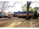 Brick house with screened porch and patio at 4308 Glenfall Ave, Charlotte, NC 28210