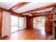 Open living room with hardwood floors and view of kitchen at 4308 Glenfall Ave, Charlotte, NC 28210