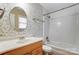 Bathroom with updated vanity and patterned wallpaper at 4452 Huntington Dr, Gastonia, NC 28056