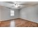 Spacious bedroom with ceiling fan and wood floors at 4452 Huntington Dr, Gastonia, NC 28056