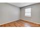 Simple bedroom with wood floors and window at 4452 Huntington Dr, Gastonia, NC 28056