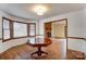 Cozy dining area with wood floors and brick fireplace view at 4452 Huntington Dr, Gastonia, NC 28056