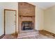 Brick fireplace with a wood mantel and gas logs at 4452 Huntington Dr, Gastonia, NC 28056