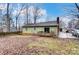 House exterior showcasing backyard, deck, and swingset at 4452 Huntington Dr, Gastonia, NC 28056