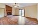 Living room with hardwood floors, brick fireplace, and sliding doors at 4452 Huntington Dr, Gastonia, NC 28056