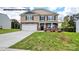 Two story house with stone accents and a landscaped lawn at 453 Court House Ave, York, SC 29745