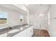 Bright bathroom featuring a double vanity and glass enclosed shower at 4618 Harris Elliot Rd, Lincolnton, NC 28092
