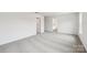 Bedroom with light colored carpet and neutral walls featuring views into an ensuite bathroom at 4618 Harris Elliot Rd, Lincolnton, NC 28092