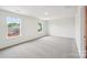 Spacious bedroom with soft carpet, two bright windows, and neutral wall color at 4618 Harris Elliot Rd, Lincolnton, NC 28092