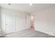 Bright bedroom with two doors and light neutral colored carpet at 4618 Harris Elliot Rd, Lincolnton, NC 28092