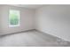 This bedroom offers a window and neutral carpet and walls at 4618 Harris Elliot Rd, Lincolnton, NC 28092