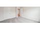Carpeted bedroom featuring two doors and neutral walls at 4618 Harris Elliot Rd, Lincolnton, NC 28092