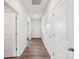 Bright hallway featuring wood floors, white walls, and doors leading to other rooms at 4618 Harris Elliot Rd, Lincolnton, NC 28092