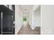 Bright hallway with wood-look floors, white walls, and doors that lead to other parts of the house at 4618 Harris Elliot Rd, Lincolnton, NC 28092