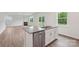 Kitchen island featuring stainless steel dishwasher, stylish cabinets, and ample counter space for meal prep at 4618 Harris Elliot Rd, Lincolnton, NC 28092