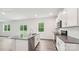 Contemporary kitchen featuring stainless steel appliances, white cabinets, and a central island for cooking convenience at 4618 Harris Elliot Rd, Lincolnton, NC 28092
