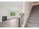 Open living room features a fireplace, modern floors and plenty of natural light from the large windows and sliding glass door at 4618 Harris Elliot Rd, Lincolnton, NC 28092