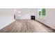 Bright, open living room with hardwood floors, fireplace, and natural light from multiple windows at 4618 Harris Elliot Rd, Lincolnton, NC 28092