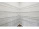 Spacious walk-in pantry featuring wire shelving that offers ample storage space at 4618 Harris Elliot Rd, Lincolnton, NC 28092