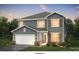 Charming two-story home featuring light blue siding, a two-car garage, and beautifully landscaped front yard at 4796 North Wynswept Dr, Maiden, NC 28650