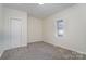 Cozy bedroom with neutral walls, carpet flooring, and a spacious closet at 520 Waddell Dr, Albemarle, NC 28001