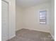 Bright bedroom with carpet, closet, and a window at 520 Waddell Dr, Albemarle, NC 28001