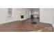 Spacious living room with hardwood floors and a brick fireplace at 520 Waddell Dr, Albemarle, NC 28001