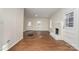 Living room features hardwood floors, a brick fireplace, and an open floor plan at 520 Waddell Dr, Albemarle, NC 28001