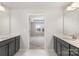 En Suite bathroom featuring double vanities and an entrance to the primary bedroom at 545 Shallowford Dr, Rock Hill, SC 29732