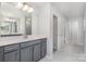 Bathroom features a gray vanity with white countertop and a view of the hallway at 545 Shallowford Dr, Rock Hill, SC 29732