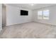 Spacious bedroom with two windows for natural light, neutral walls, and carpeted floors at 545 Shallowford Dr, Rock Hill, SC 29732