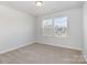 Bedroom has lots of natural light from the two windows, and neutral carpet at 545 Shallowford Dr, Rock Hill, SC 29732