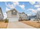 Two-story house with gray and brown siding, a covered porch, and a two-car garage at 545 Shallowford Dr, Rock Hill, SC 29732