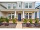 Front porch with dark-colored door and brick accents at 545 Shallowford Dr, Rock Hill, SC 29732