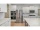 Gleaming stainless-steel refrigerator and built-in ovens nestled in a modern white kitchen at 545 Shallowford Dr, Rock Hill, SC 29732