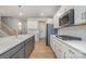 A modern kitchen featuring stainless appliances, gas range, white cabinets, and a central island at 545 Shallowford Dr, Rock Hill, SC 29732