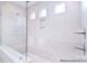 Spa-like shower with built-in shelving and a glass enclosure at 558 Edmunds Ln # 41, Clover, SC 29710