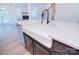 Farmhouse sink in a large kitchen island with white quartz countertops at 558 Edmunds Ln # 41, Clover, SC 29710