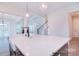 Island kitchen with white quartz countertops and farmhouse sink at 558 Edmunds Ln # 41, Clover, SC 29710