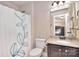 Well-lit bathroom offers a shower/tub combo, granite vanity, and a view of a bedroom at 5600 Ballenger Ct, Waxhaw, NC 28173