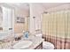 Clean bathroom boasts granite countertop, modern vanity, and shower with curtain at 5600 Ballenger Ct, Waxhaw, NC 28173