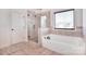 Spa-like bathroom with soaking tub and walk-in shower at 5600 Ballenger Ct, Waxhaw, NC 28173